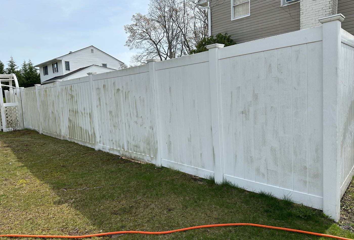 Vinyl fence before cleaning